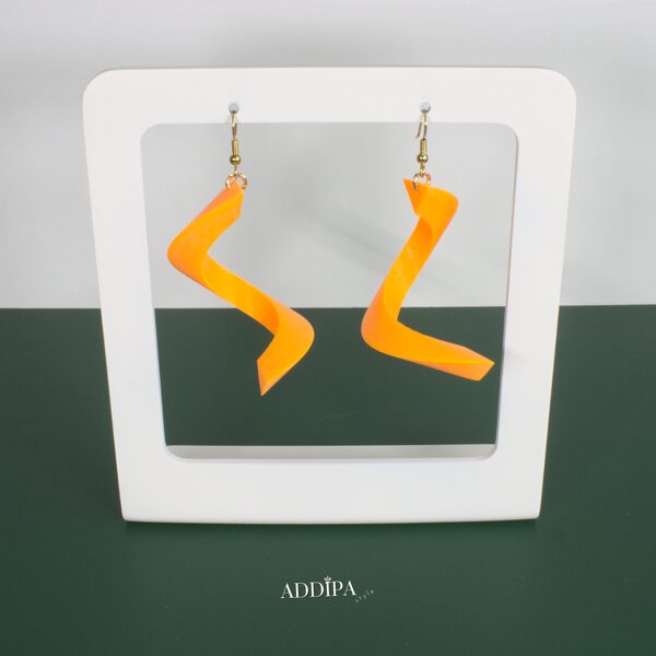 3D printed earrings - orange spirals.
