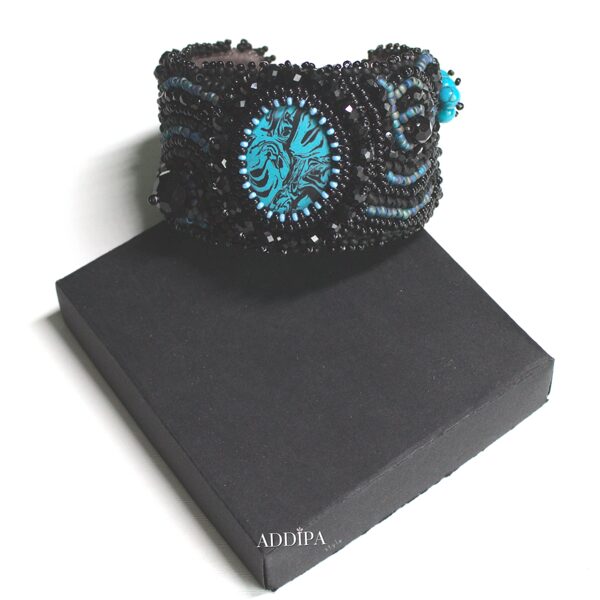 Black beaded bracelet with turquoise blue cabochon